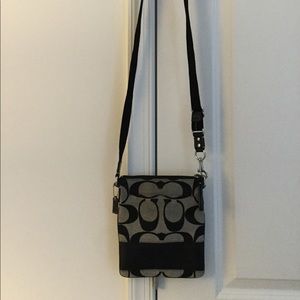 Black and gray coach signature crossbody purse